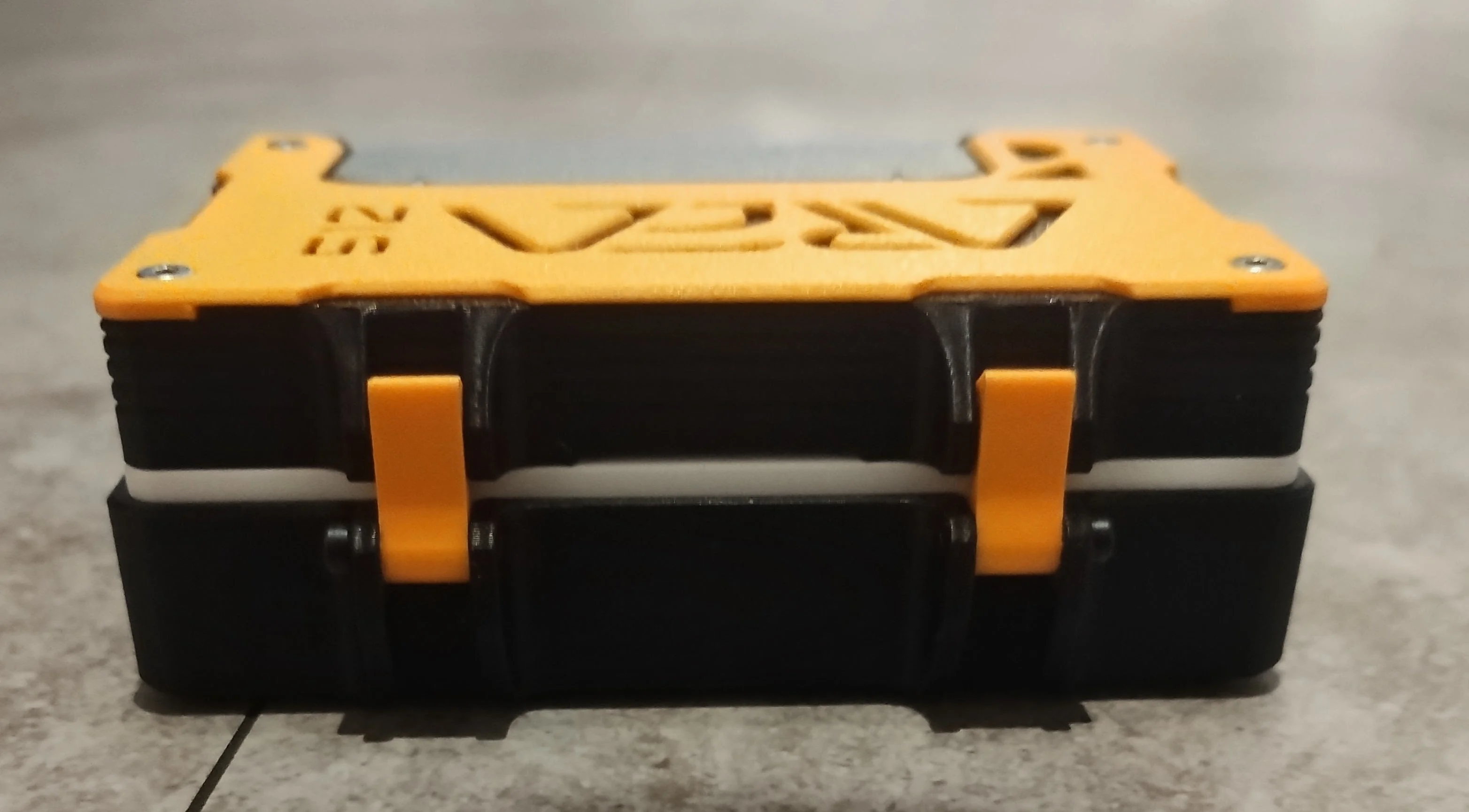 Two orange latches securing the closed TERM512 case